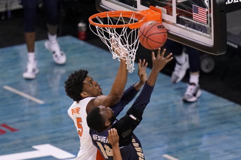 Oral Roberts forward DeShang Weaver (14) shoots ahead of Florida forward Omar Payne (5) during the second round of the NCAA Tournament at Indiana Farmers Coliseum on March 21 in Indianapolis. (AJ MAST/Associated Press)