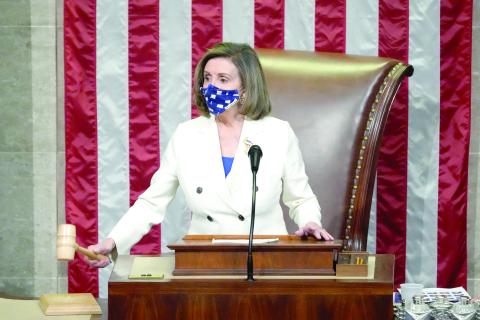 Speaker of the House Nancy Pelosi, D- Calif., raps her gavel after the House voted to pass the American Rescue Plan on Wednesday in Washington, D.C. (DREW ANGERER/Getty Images/TNS)