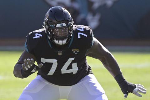 Jacksonville Jaguars offensive tackle Cam Robinson (74) sets up to block against the Chicago Bears on Dec. 27, 2020, in Jacksonville. The Jaguars are planning to use the franchise tag on left tackle Cam Robinson, preventing him from hitting the free-agent market and making him the blindside protector for presumptive No. 1 draft pick Trevor Lawrence. Coach Urban Meyer said Tuesday that “we are headed in that direction.” (AP FILE PHOTO)