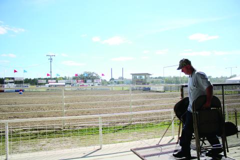 Ray Robinson sets up a row of chairs Wednesday afternoon while preparing the Florida Gateway Fairgrounds Rodeo Arena for the Florida Gateway Pro Rodeo, which takes place this weekend. (TONY BRITT/Lake City Reporter)