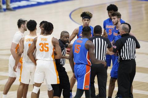 Tennessee and Florida players are separated after a foul by Florida's Omar Payne (5) in the second half of  the Southeastern Conference Tournament quarterfinals on Friday in Nashville, Tenn. Payne was ejected from the game after dealing a pair of elbows to John Fulkerson. (MARK HUMPHREY/Associated Press)