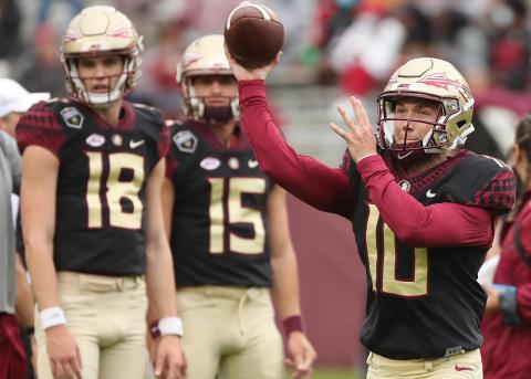 FSU quarterbacks Tate Rodemaker (18) and Gino English (15) watch quarterback McKenzie Milton (10) throw during the FSU Garnet & Gold Spring Game at Doak Campbell Stadium on April 10 in Tallahassee. (STEPHEN M. DOWELL/Orlando Sentinel)
