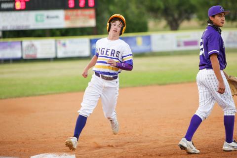 Columbia pitcher Matthew Dumas walks off the field after getting stranded at second base in the third inning of Tuesday’s game against Gainesville. (BRENT KUYKENDALL/Lake City Reporter)