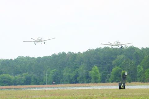 Two Beechcraft Bonanza airplanes take off from the Lake City Gateway Airport runway 10/28 on Friday afternoon. (TONY BRITT/Lake City Reporter)