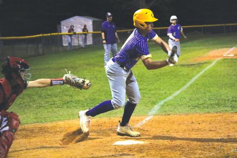 Columbia second baseman Truitt Todd lays down a bunt to score Cole Williams for the  game-winning win against Baker County on Tuesday night. (MORGAN MCMULLEN/Lake City Reporter)