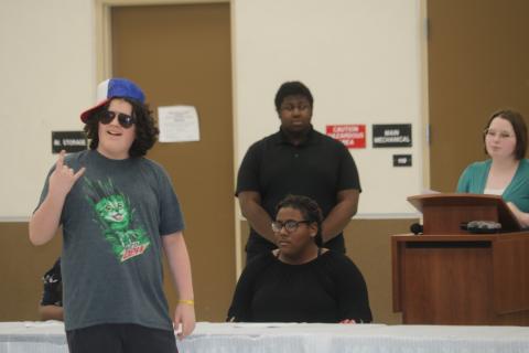 Nickolas Steward, foreground, portrays a skateboarder during a theatrical presentation Wednesday at the National Guard Armory during local National Youth Leadership Week festivities. (TONY BRITT/Lake City Reporter)