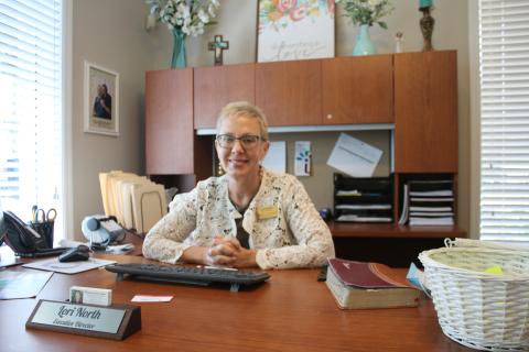Lori North at her desk. (TONY BRITT/Lake City Reporter)