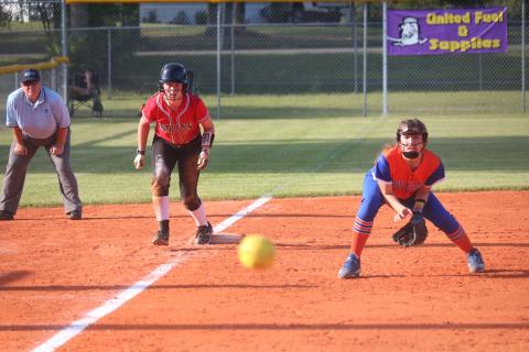 Fort White pitcher Hannah LeBleu takes a lead off of third base as a pitch flies by during Tuesday night’s District 6-1A semifinal against Taylor County. (JORDAN KROEGER/Lake City Reporter)