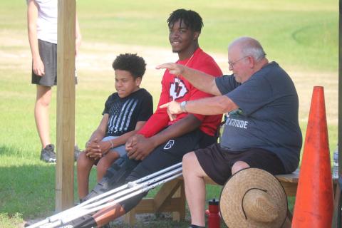 Fort White quarterback Tyler Jefferson watches practice from the sideline on Wednesday. Jefferson is out for all of spring practice after having knee surgery about six weeks ago. (JORDAN KROEGER/Lake City Reporter)
