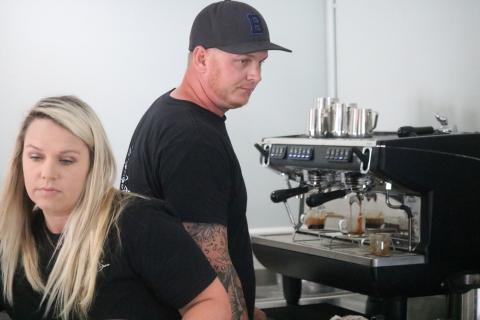 Brooke Bass (left) mixes up a drink at Suwannee Brew Coffee Co. alongside her husband Aaron. They just opened up their shop a couple of weeks ago to great reception. (JAMIE WACHTER/Lake City Reporter)