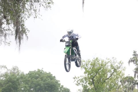 Team FMX rider Trevor Cartmill comes down on the landing ramp after jumping over Ellie Ray’s Bar at the Ellie Ray’s RV Resort & Lounge on Saturday afternoon. (MORGAN MCMULLEN/Lake City Reporter)