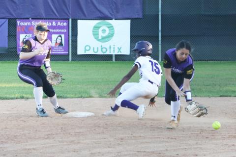 Columbia second baseman Sofia Arata can’t hold onto a throw as Gainesville’s Jayla Clark slides safely into second base. (MORGAN MCMULLEN/Lake City Reporter)