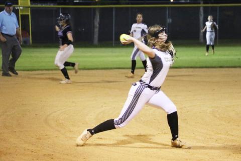 Columbia pitcher Emma Edson fires to first base for an out against Gainesville during the District 3-5A semifinals on Tuesday night. (MORGAN MCMULLEN/Lake City Reporter)