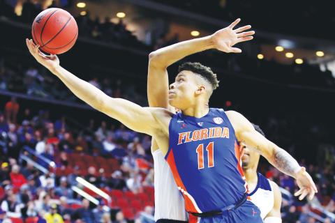 Florida forward Keyontae Johnson, seen here in a 2019 game, was hospitalized in critical but stable condition after collapsing on court during a game against Florida State last season. (ANDY LYONS/Getty Images/TNS)