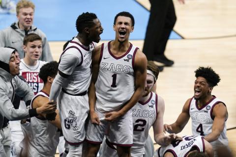 Gonzaga guard Jalen Suggs (1) celebrates making the game-winning basket with Joel Ayayi, left, against UCLA during overtime in the Final Four semifinal game at Lucas Oil Stadium on Saturday in Indianapolis. Gonzaga won 93-90. (MICHAEL CONROY/Associated Press)