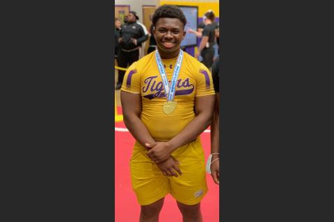 Columbia’s Julius Moreland smiles with his state medal after winning the Class 2A state title in the 219-pound weight class on Saturday. (COURTESY)