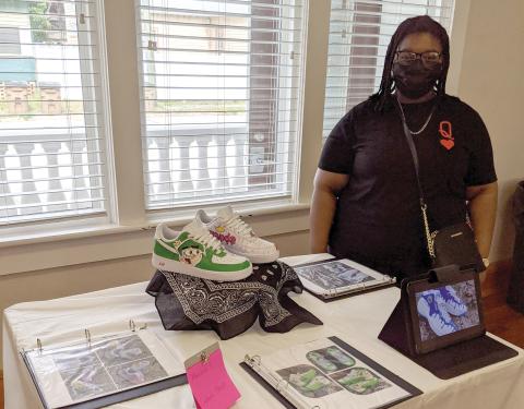 Columbia High junior Marchela Stroud shows off a pair of custom shoes she makes through her business, ‘Your Idea My Creation.’ (COURTESY)