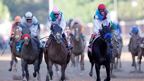 John Velazquez rides Medina Spirit ahead of Florent Geroux aboard Mandaloun and Flavien Prat aboard Hot Rod Charlie to win the 147th running of the Kentucky Derby at Churchill Downs on Saturday in Louisville, Ky. (SARAH STIER/Getty Images/TNS)