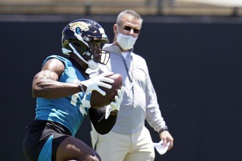 Jacksonville Jaguars wide receiver Jalen Camp, left, catches a pass as head coach Urban Meyer looks on during Saturday’s practice in Jacksonville. (JOHN RAOUX/Associated Press)