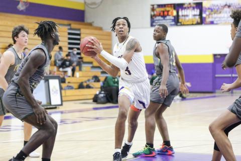 Columbia forward Charleston Ponds drives to the basket against Trinity Catholic this past season. (BRENT KUYKENDALL/Lake City Reporter)