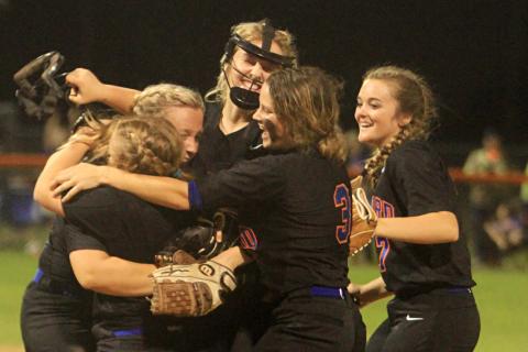 Branford’s softball team celebrates after defeating Hilliard 6-1 in the Region 3-1A semifinals on Thursday. It was the first playoff win in program history. (PAUL BUCHANAN/Special to the Reporter)
