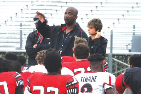 Fort White coach Demetric Jackson talks to his team following the Red & Black game on Thursday. (MORGAN MCMULLEN/Lake City Reporter)
