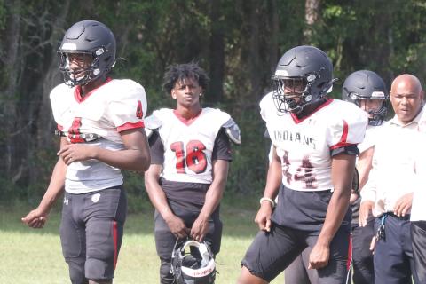 Fort White quarterback Darren Clark (left) and running back Jaylen Brown (right) line up in the shotgun during Tuesday’s practice. (MORGAN MCMULLEN/Lake City Reporter)