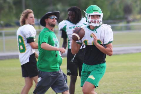 Suwannee quarterback Kodi Lang sets to pass during practice on April 29. (JAMIE WACHTER/Lake City Reporter)