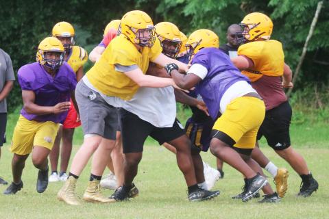 Columbia’s offensive line battles the defensive line during practice last Thursday. Caleb Pope and Travis Matthews are getting their first varsity looks at tackle this spring. (JORDAN KROEGER/Lake City Reporter)