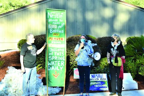 Our Santa Fe River members Michael Roth, from left, Merrillee Malwitz-Jipson and Kristin Rubin protest outside the Suwannee River Water Management District headquarters on the morning of February 23. (FILE)