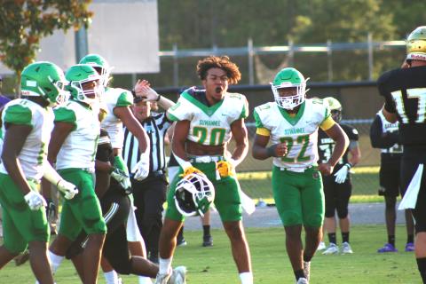 Travis McKinney celebrates after a goal line fourth down stop during Friday’s win over Oakleaf. (JAMIE WACHTER/Lake City Reporter)