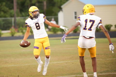 Columbia receiver Jace Hoskey (left) celebrates with Eddrin Thompson after catching a touchdown pass during Friday’s spring game against Bartram Trail. (BRENT KUYKENDALL/Lake City Reporter)