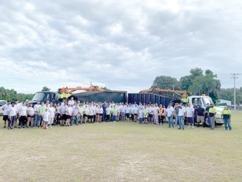 City workers and volunteers pose for a picture before beginning the inaugural county-wide cleanup day work on Saturday morning. Nearly 100 volunteers from Christ Central Ministries participated in the inaugural effort. (COURTESY)
