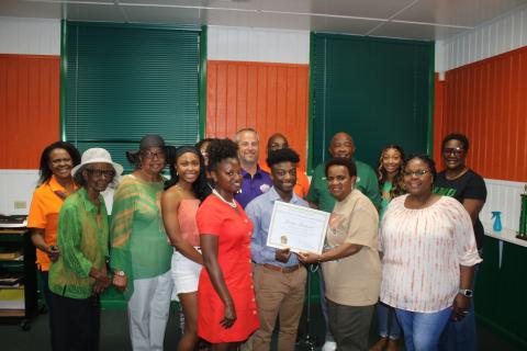 Nicole Newton (front row, from left), Jordyn Johnson, Annie Brooks (Columbia County president of the FAMU Alumni Association) and Trisheka Nelson. (Back row, from left) Pam Miller, Arleen Lofton Poitier, Corrine Lofton, Tonita Orr, Nyla Sams, Trey Hosford, Al Nelson, Mario Coppock, Aniya  Timmons and Evette Watson pose for a photograph during the Jordyn Johnson FAMU scholarship award ceremony. (TONY BRITT/Lake City Reporter)