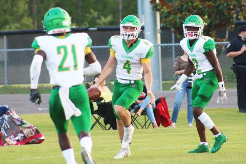 Suwannee receiver Garrison Beach (4) celebrates with teammates after catching a touchdown pass against Oakleaf in the teams’ spring game on May 21. (JAMIE WACHTER/Lake City Reporter)