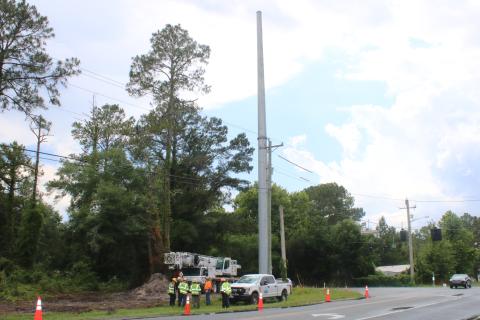 Pike Electric is working on installing newer, taller power lines along Old Country Club Road and County Road 252. (JAMIE WACHTER/Lake City Reporter)