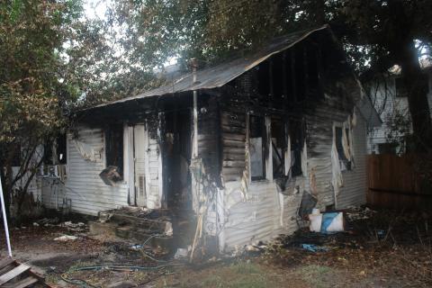 The remains of the house at 441 Northwest Madison Street after a fire destroyed much of the property in and surrounding the home. (COURTESY)