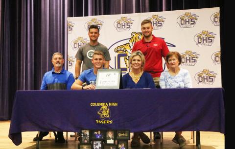 Columbia goalkeeper Colby Strickland (left center) signed his letter of intent to play at Shorter University on Wednesday in the high school auditorium. Strickland is pictured with his father, Sid (bottom left), his mother, Donna (center right), his grandmother Brenda Outlaw (bottom right), and his brothers Caleb (top left) and Jacob (top right). (JORDAN KROEGER/Lake City Reporter)
