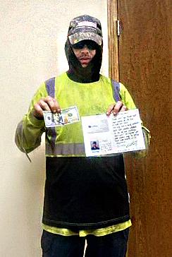 Joel Grecian poses with his $100 and thank-you note from Waste Pro. (COURTESY)