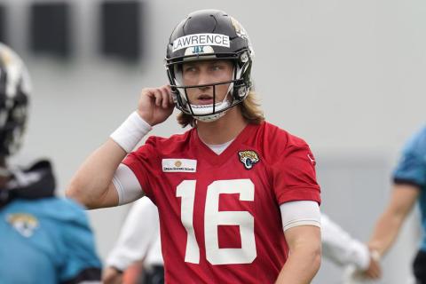 Jacksonville Jaguars quarterback Trevor Lawrence takes a break during practice Monday in Jacksonville. (JOHN RAOUX/Associated Press)