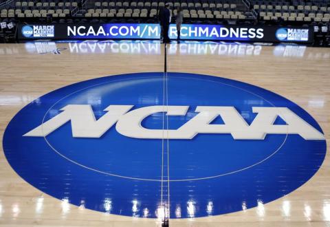 The NCAA logo is displayed as work continues at The Consol Energy Center for the NCAA Tournament on March 15, 2015, in Pittsburgh. The NCAA Board of Directors is expected to greenlight one of the biggest changes in the history of college athletics when it clears the way for athletes to start earning money based on their fame and celebrity without fear of endangering their eligibility or putting their school in jeopardy of violating amateurism rules that have stood for decades. (AP FILE PHOTO)