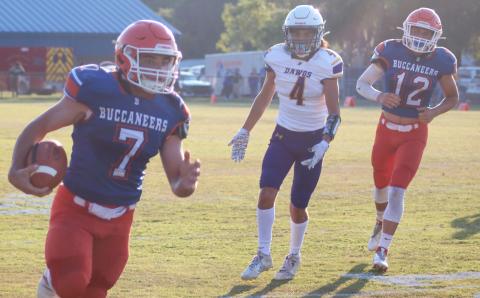 Branford running back Bodhi White bolts down the field for a touchdown against Bell in the teams’ spring game on May 24. (JAMIE WACHTER/Lake City Reporter) 