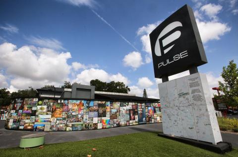 Photos and keepsakes adorn the Pulse Interim Memorial located at the Pulse nightclub site south of downtown Orlando, Thursday, June 6, 2019. June 12 marked the fifth anniversary of the mass shooting that left 49 club patrons dead. (JOE BURBANK/Orlando Sentinel/TNS)
