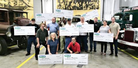 Nine Waste Pro employees were surprised recently with a $10,000 bonus for 20 years of service to the company, which was founded 20 years ago in Central Florida. Employees honored included, in front, Judi Craigo (from left) and Edwin Hernandez; in back, Larry Harned, Executive Board Chairman and founder John Jennings, Ted Oglesby, William Green, Kevin Wells, Neil Wood, Frank Kramer, Vanessa Kramer and Sean Jennings. (COURTESY)