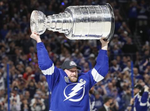 Tampa Bay Lightning center Steven Stamkos hoists the Stanley Cup after the Lightning defeated the Montreal Canadiens 1-0 in Game 5 Wednesday in Tampa. (DIRK SHADD/Tampa Bay Times/TNS)