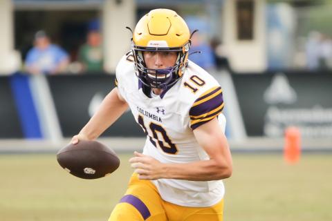Columbia quarterback Kade Jackson scrambles up the field for yardage against Bartram Trail during the teams’ spring game on May 28. (BRENT KUYKENDALL/Lake City Reporter)