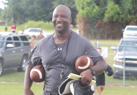 Demetric Jackson smiles during a Fort White practice in 2019. Jackson is leaving FWHS to take over as head coach at Columbia. (FILE)