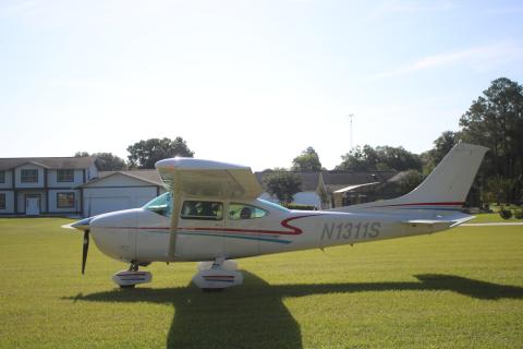 A plane carrying a Isaac Bell and Micah Bell stops on the grass after taking the two youngsters up during the Young Eagles Rally. (TONY BRITT/Lake City Reporter)