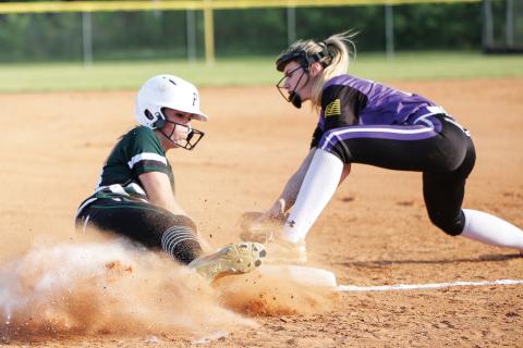 Suwannee’s Karis Smith (left) slides in underneath a tag last season against Columbia. Smith ended her junior season as the team’s ace in the cirlce, finishing 8-4 with a 2.88 ERA. (BRENT KUYKENDALL/Lake City Reporter)