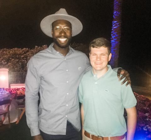 Eli Stewart (right) poses with former Gators basketball star Patric Young during the Tom Coughlin Jay Fund Celebrity Golf Classic in May. (COURTESY)
